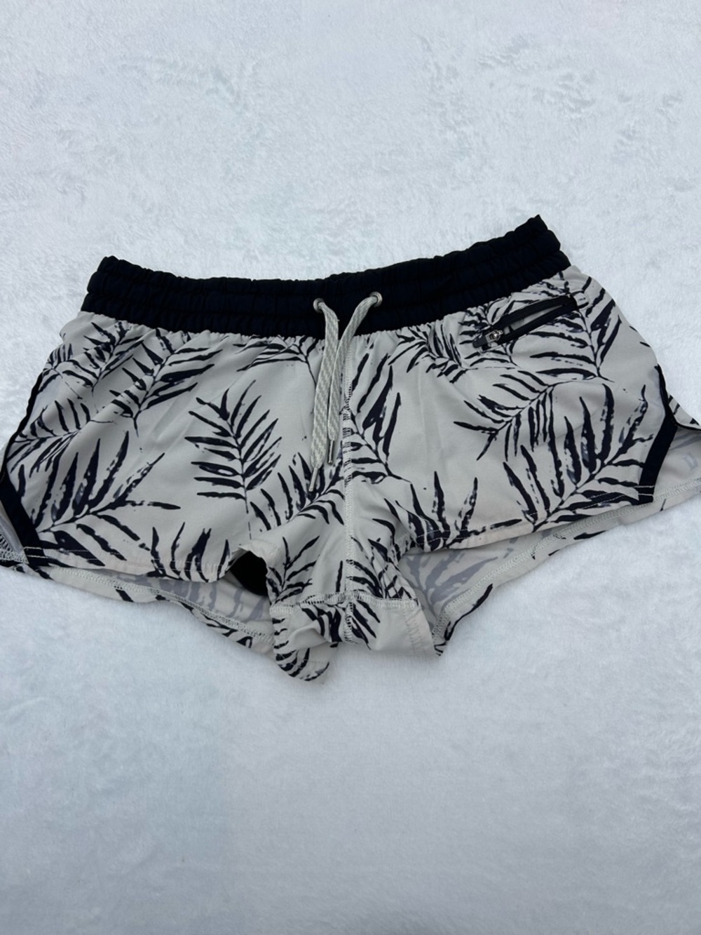 Vuori Cream Shorts with Black Leaf Print